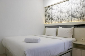 Warm and Minimalist 2BR Green Bay Pluit Apartment By Travelio
